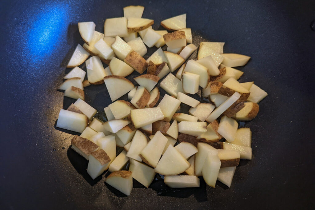 Potatoes frying in oil.