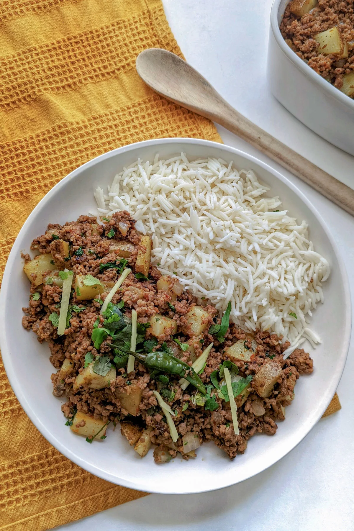 Aloo keema and rice on a plate.