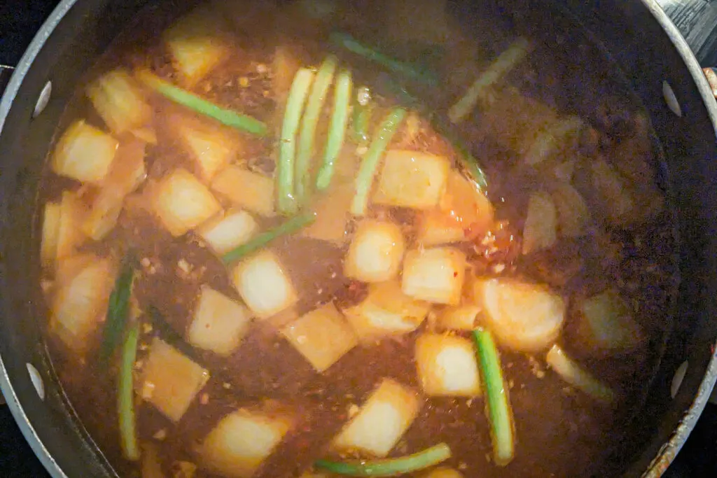 Broth simmering in a pot.