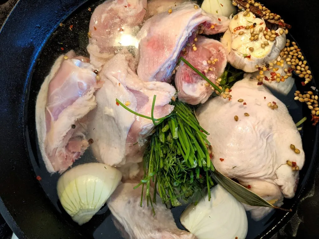 Add all the ingredients for the broth that will become the base for homemade chicken soup.
