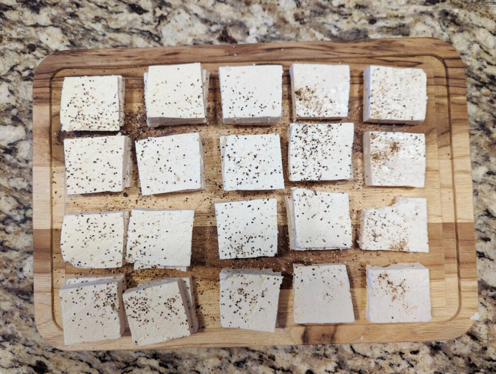Tofu patted dry helps make the sesame fried tofu crispy.