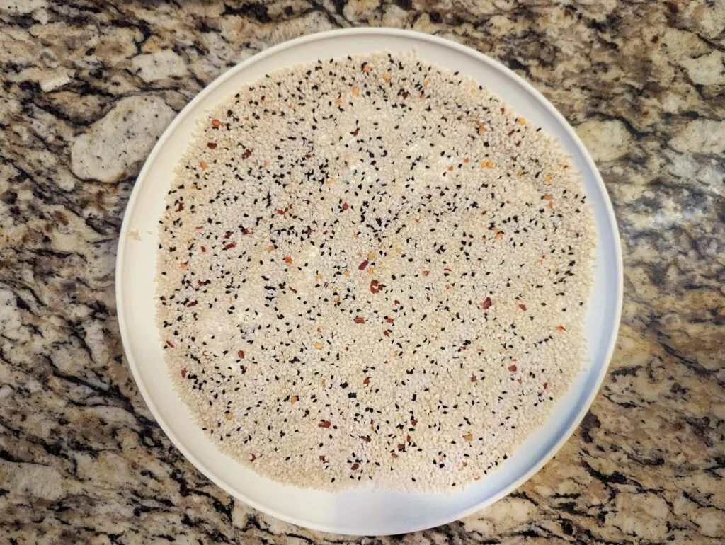 Sesame seed and panko mixture on a plate.