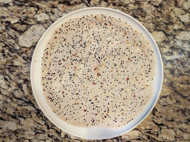Sesame seed and panko mixture on a plate.