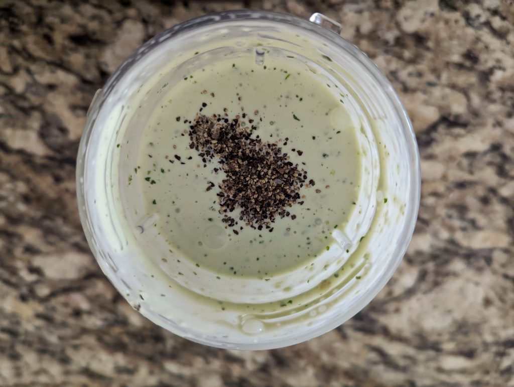 Serrano crema in a blender and seasoned with salt and pepper.