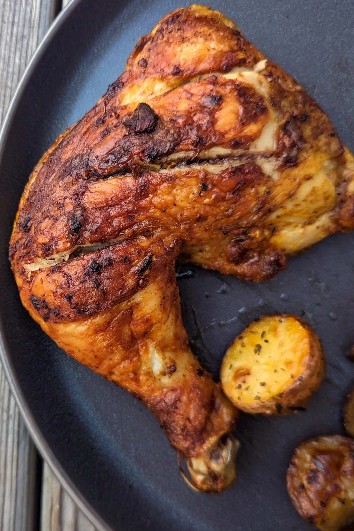 Baked tandoori chicken on a plate.