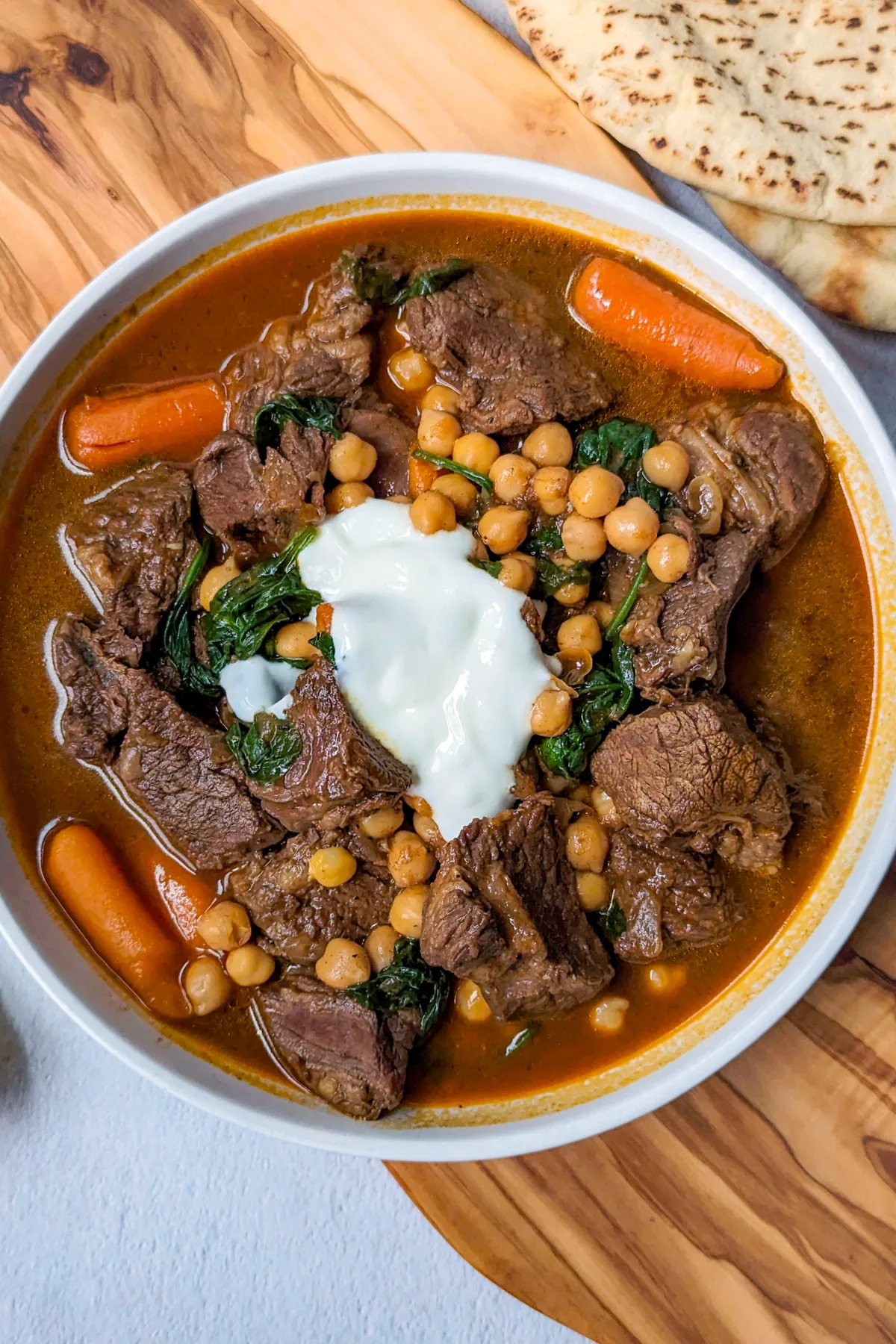 Beef and chickpea stew in a serving bowl.