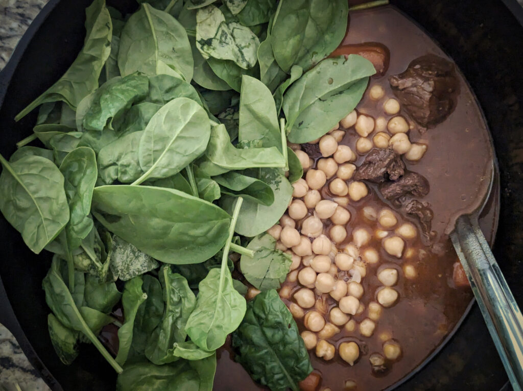 Spinach and chickpeas added to the stew.