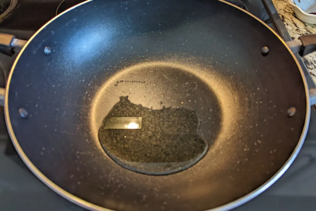 Oil warming in a wok.