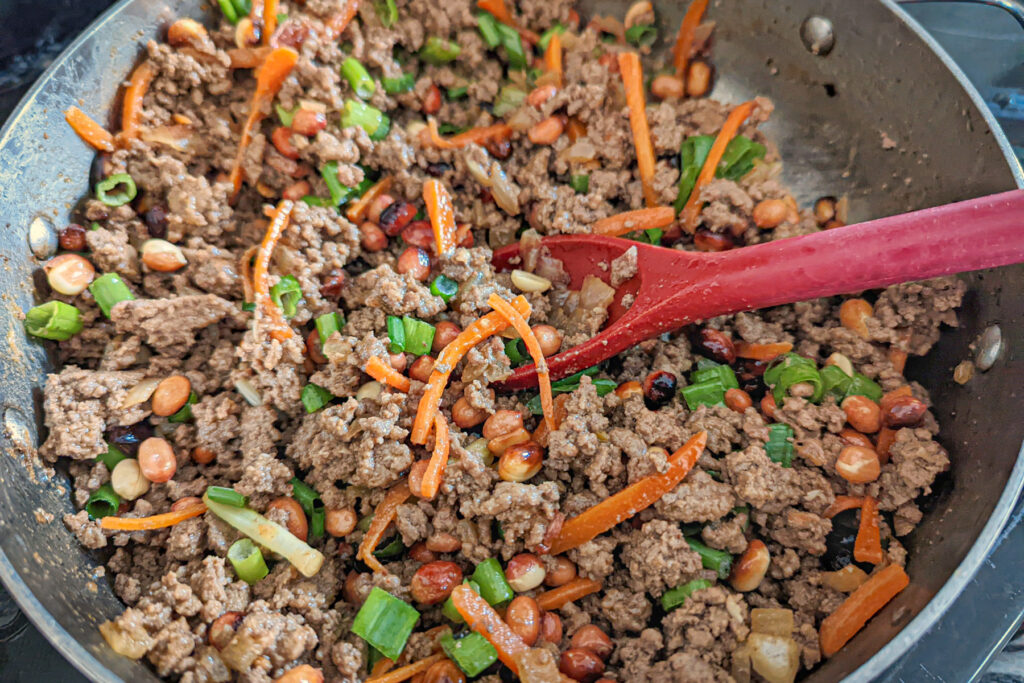 Ground Beef with all the vegetables in a pan.