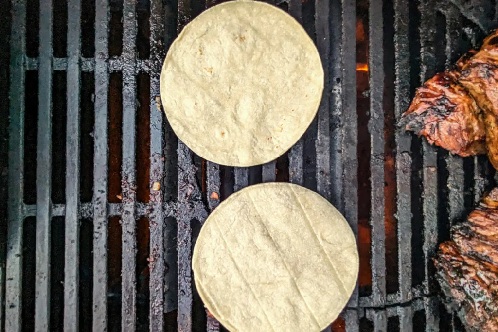 Corn tortillas on the grill. 