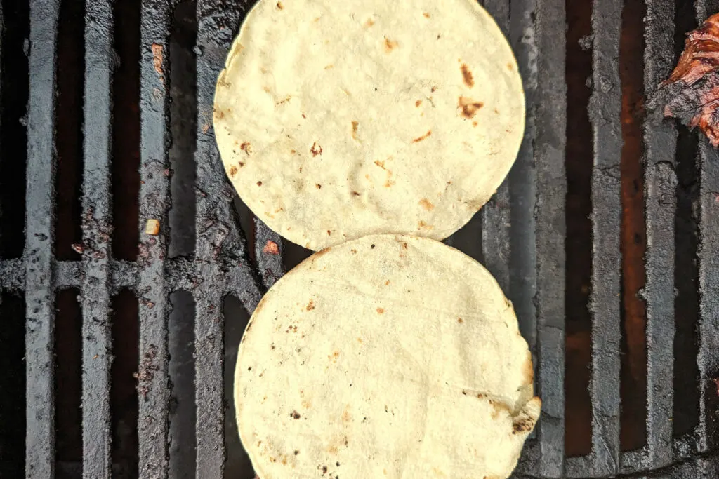 Corn tortillas on the grill. 