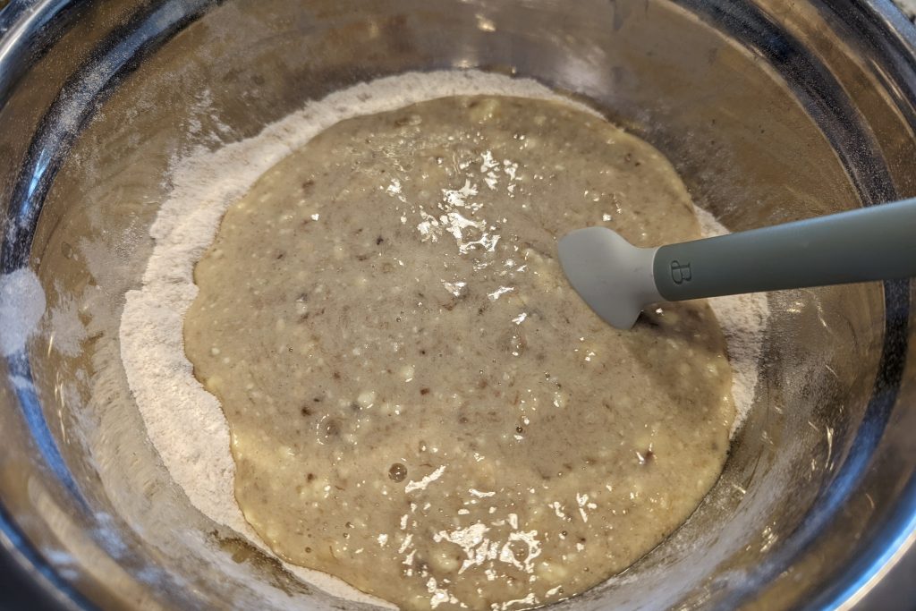 wet ingredients together in a mixing bowl for banana bread.