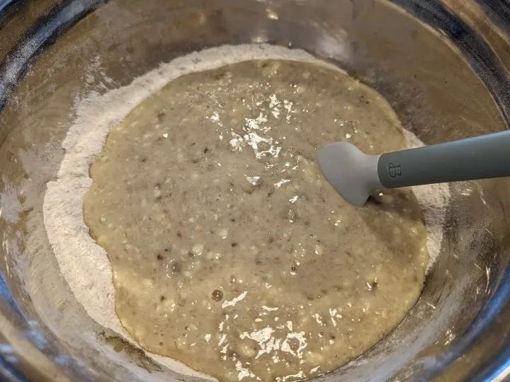 wet ingredients together in a mixing bowl for banana bread.
