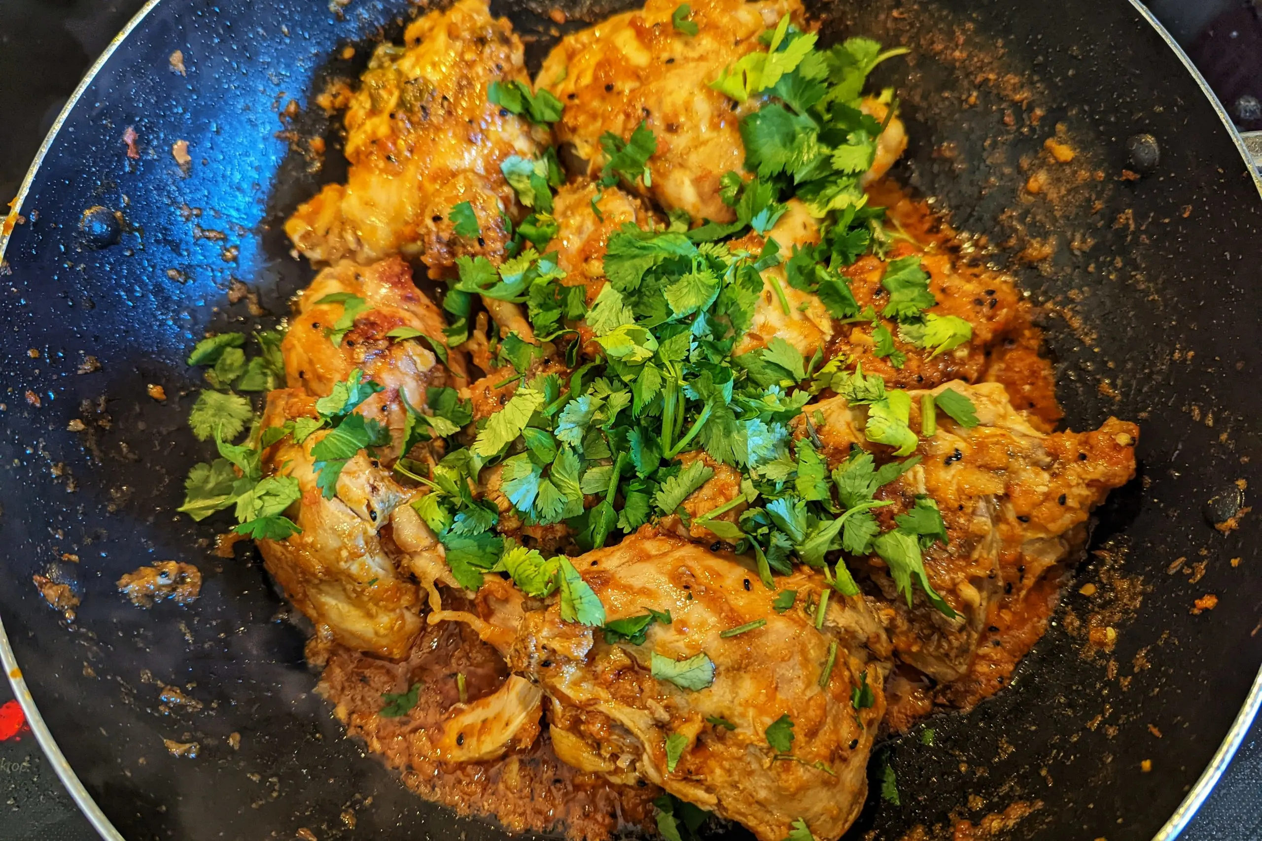 Add cilantro to Pakistani chicken karahi.