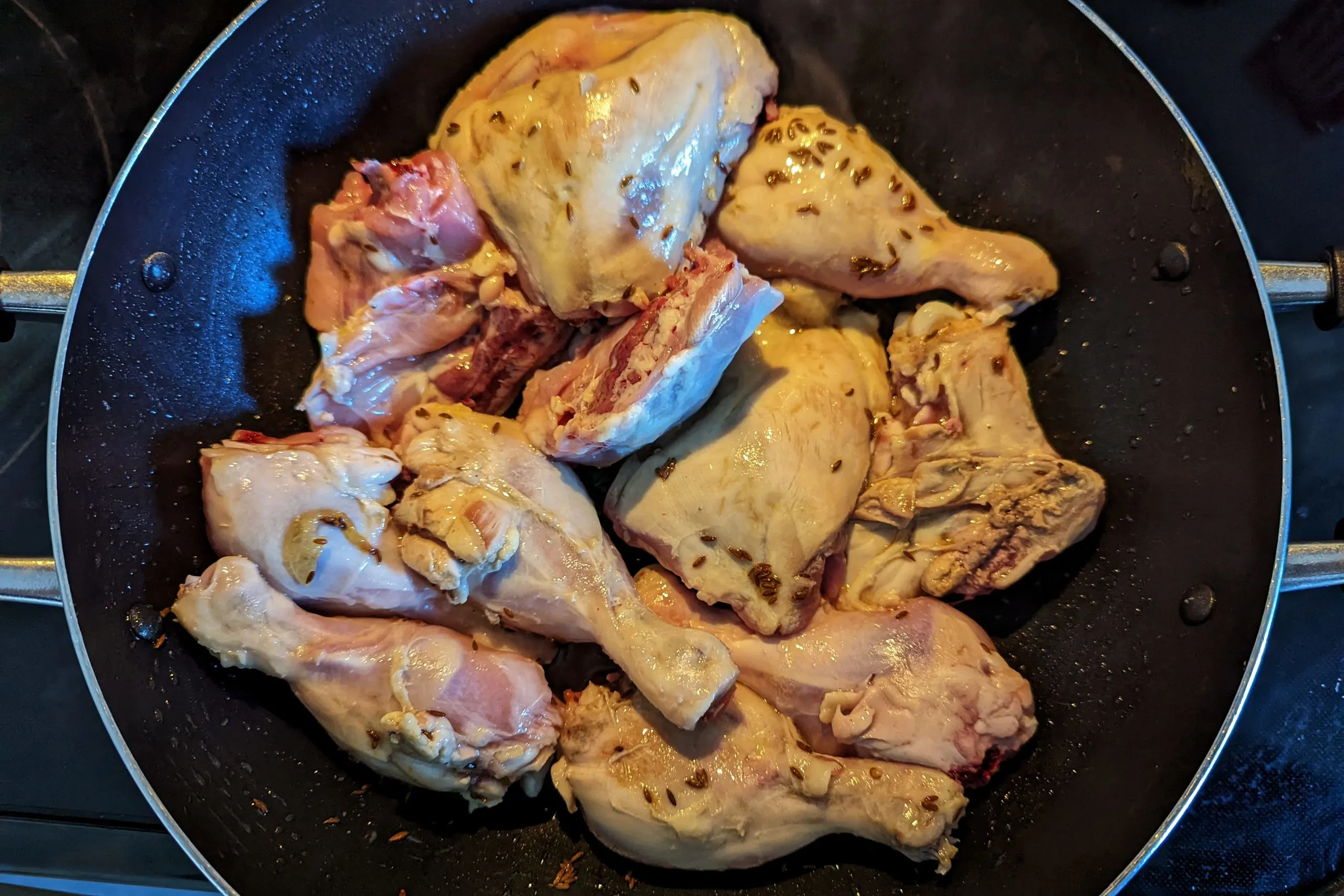 Fry the chicken pieces for Pakistani karahi.