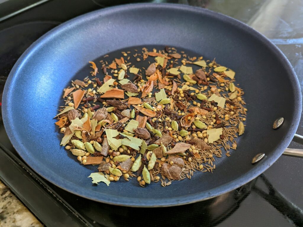 Spices for our garam masala recipe toasting to draw out the flavor.