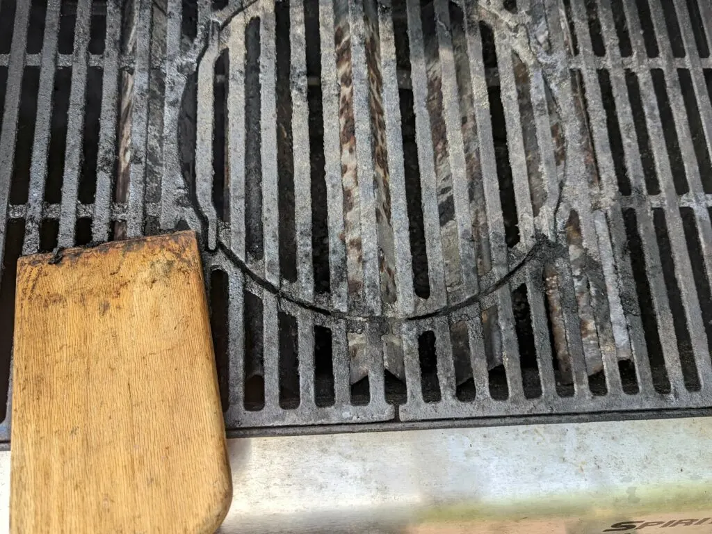 Clean the grill grates before adding the chicken.