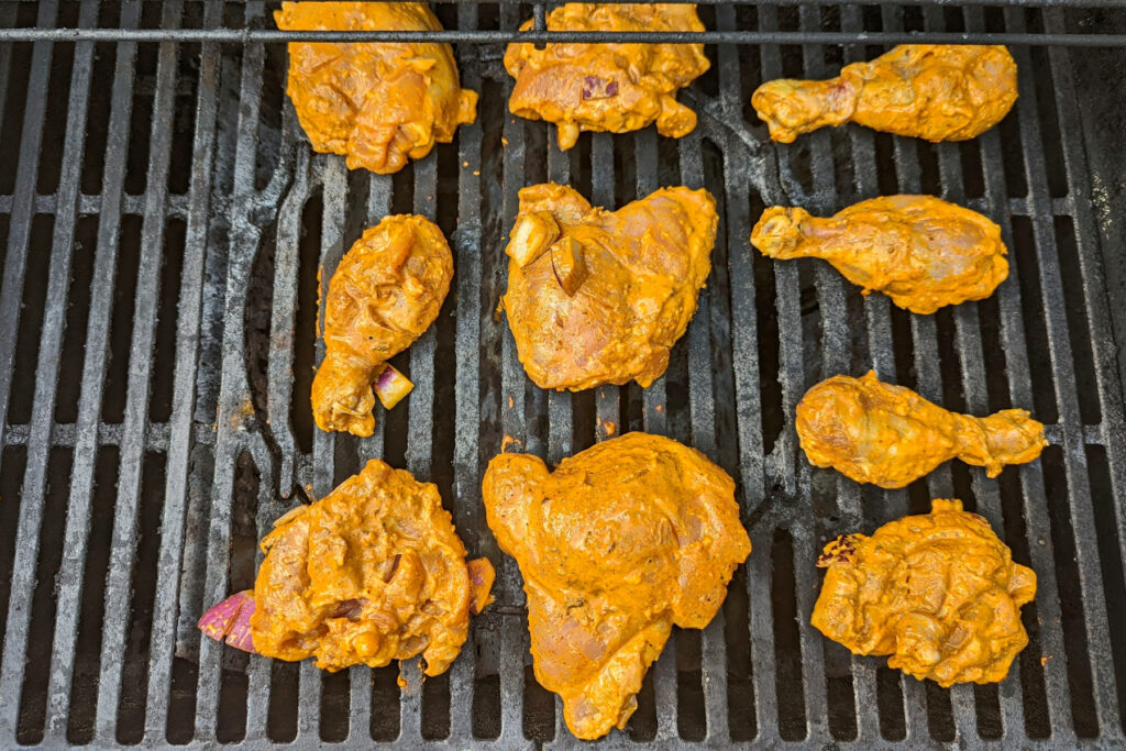 Tandoori chicken on the grill.