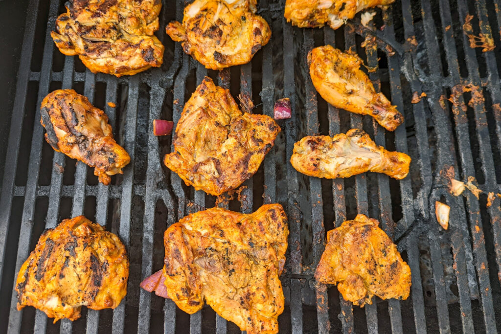 Tandoori chicken on the grill.
