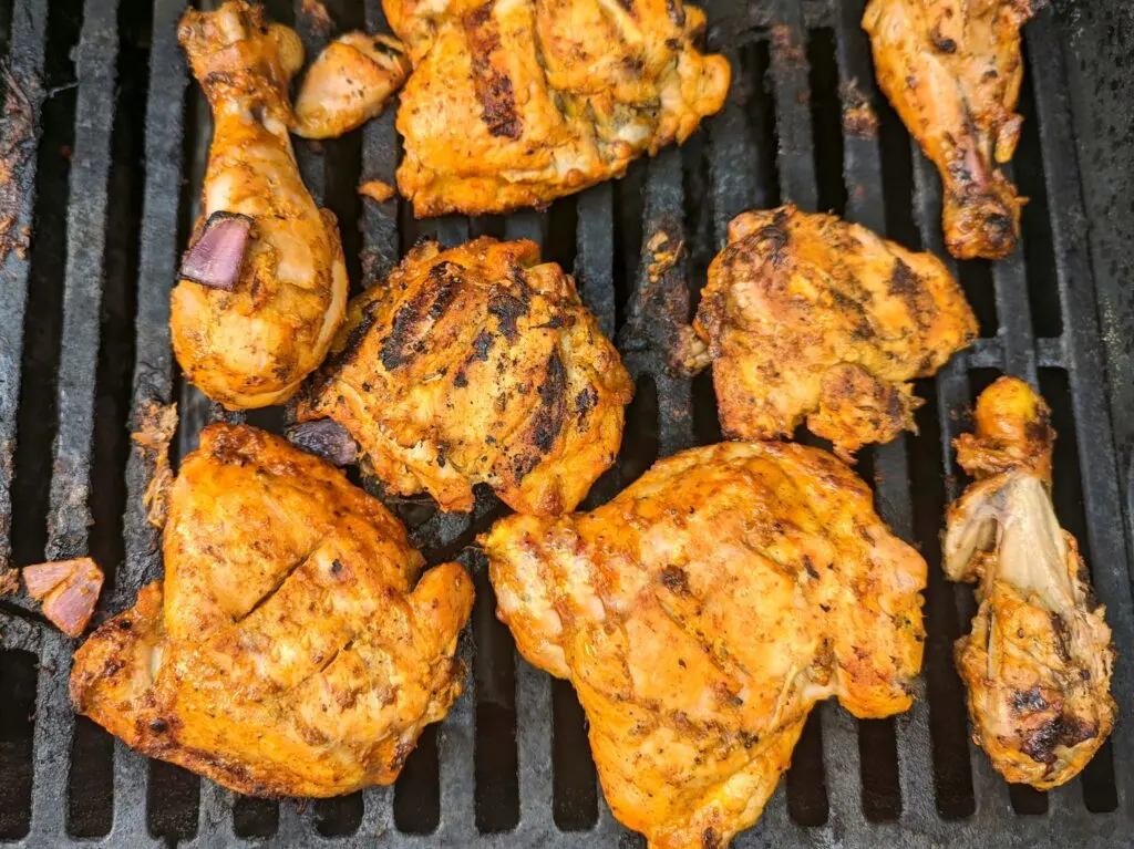 Move the chicken to the side of the grill set to low heat. Cook for 25 minutes.