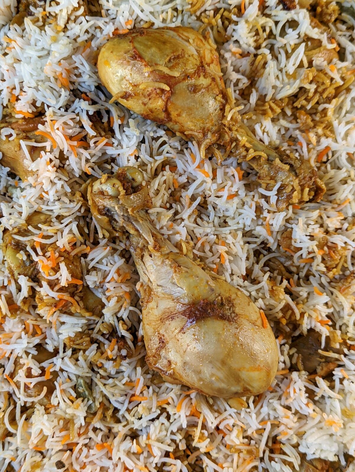 Chicken biryani in a serving dish.