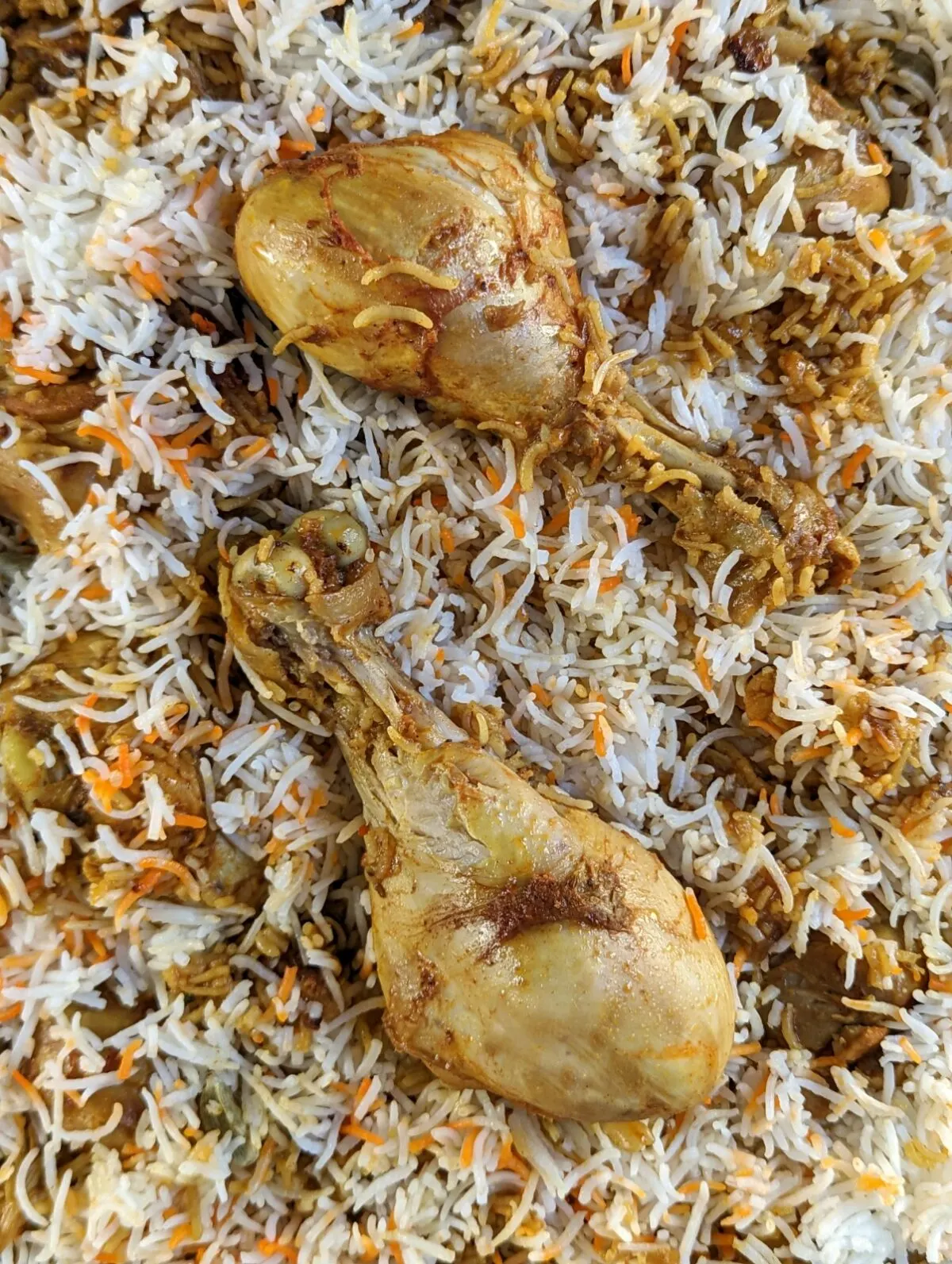 Chicken biryani in a serving dish.