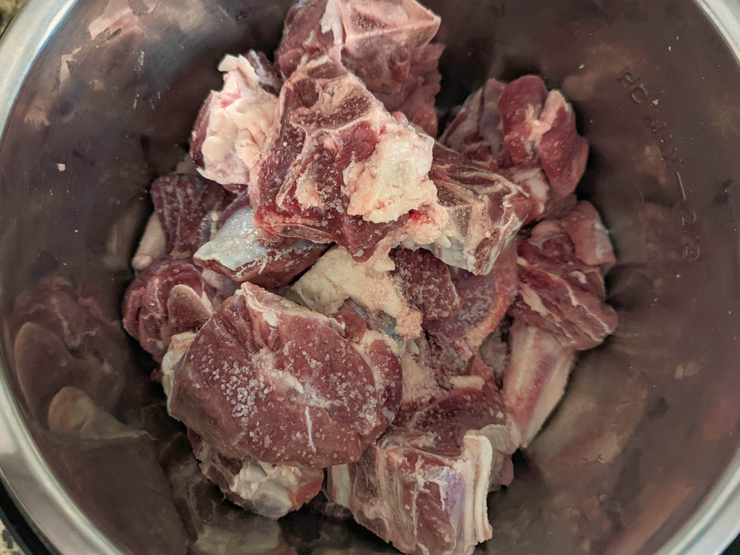 Pressure-cook the goat meat before adding it to the karahi masala. 