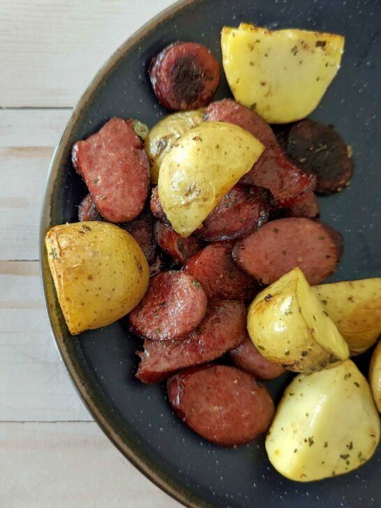 A single serving of kielbasa and potatoes.
