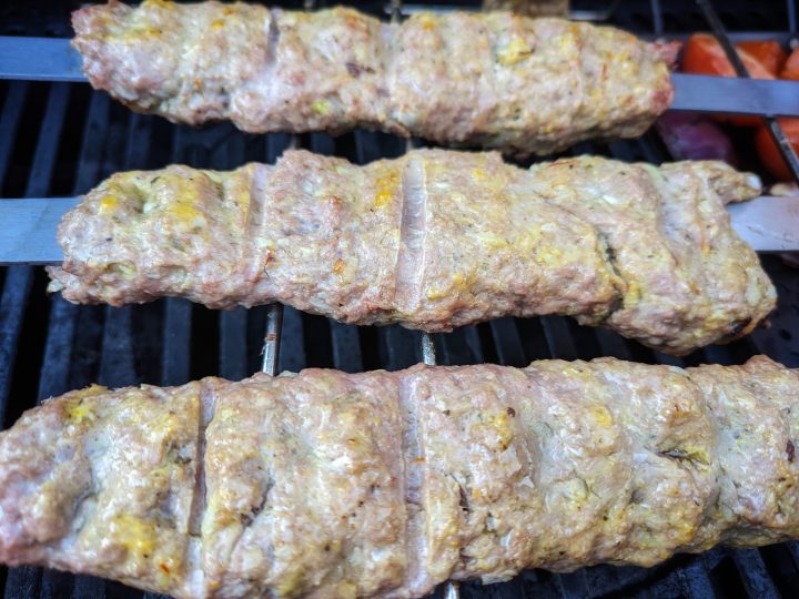 Form the meat onto the skewer and place them on the grill.