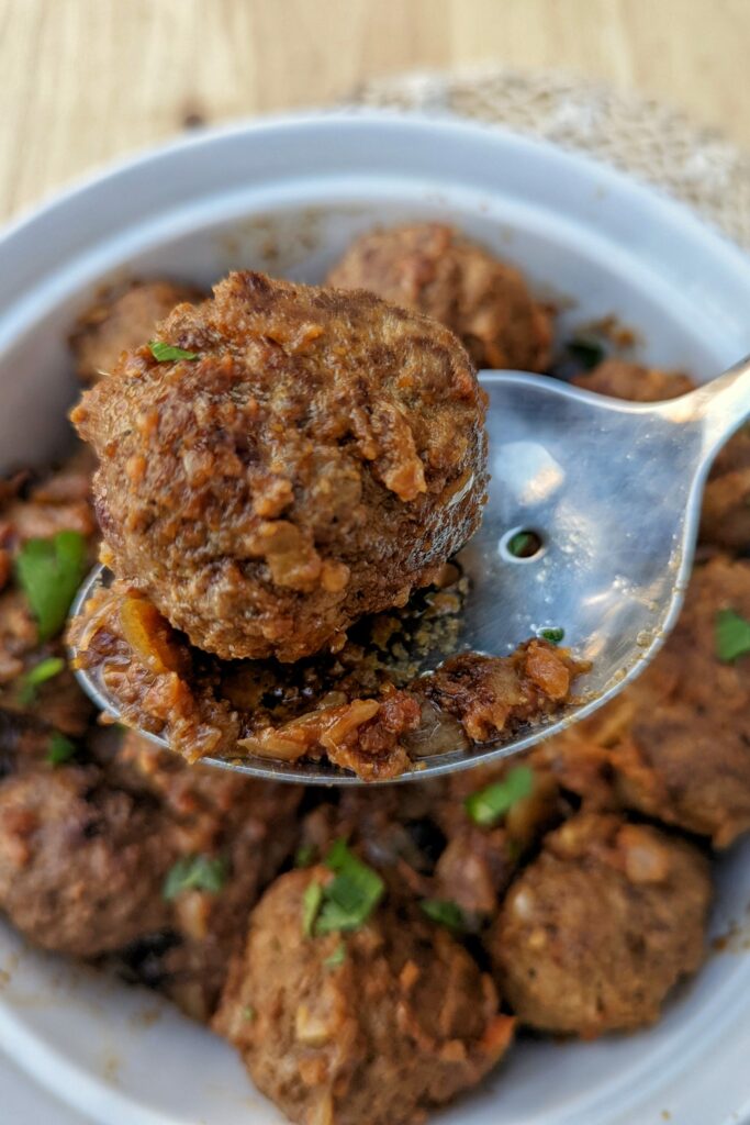 Moroccan meatballs in a serving bowl. 