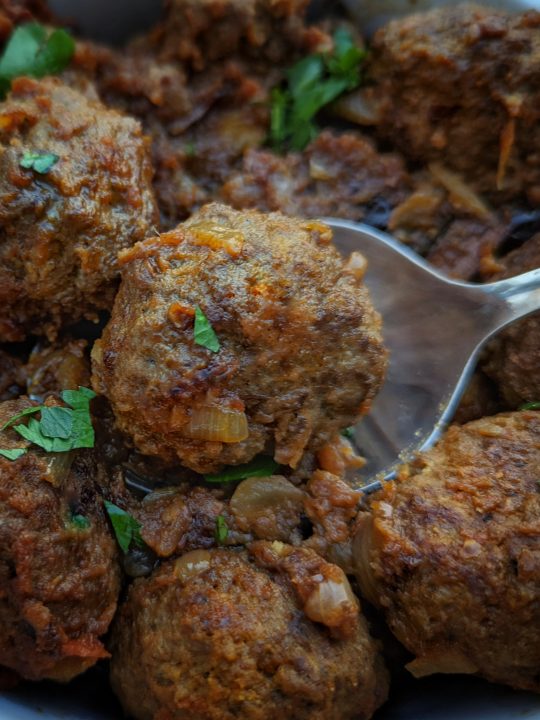 Moroccan meatballs are ready to serve in a serving bowl.