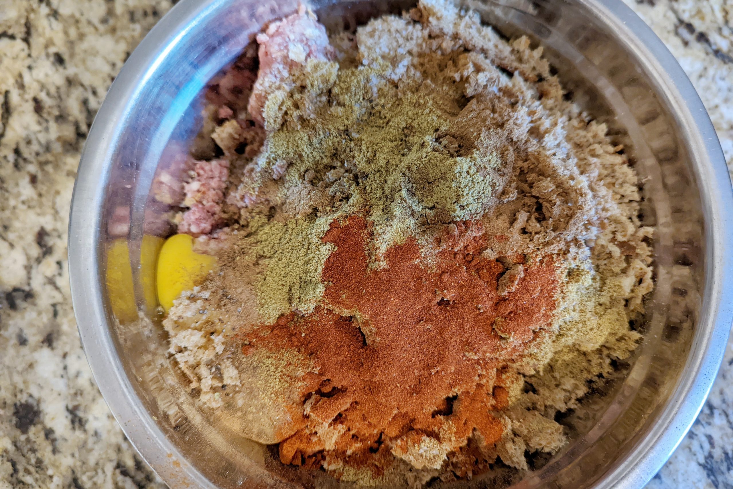 egg and spices mixed with ground beef and broken up bread crumbs for for kefta tagine.