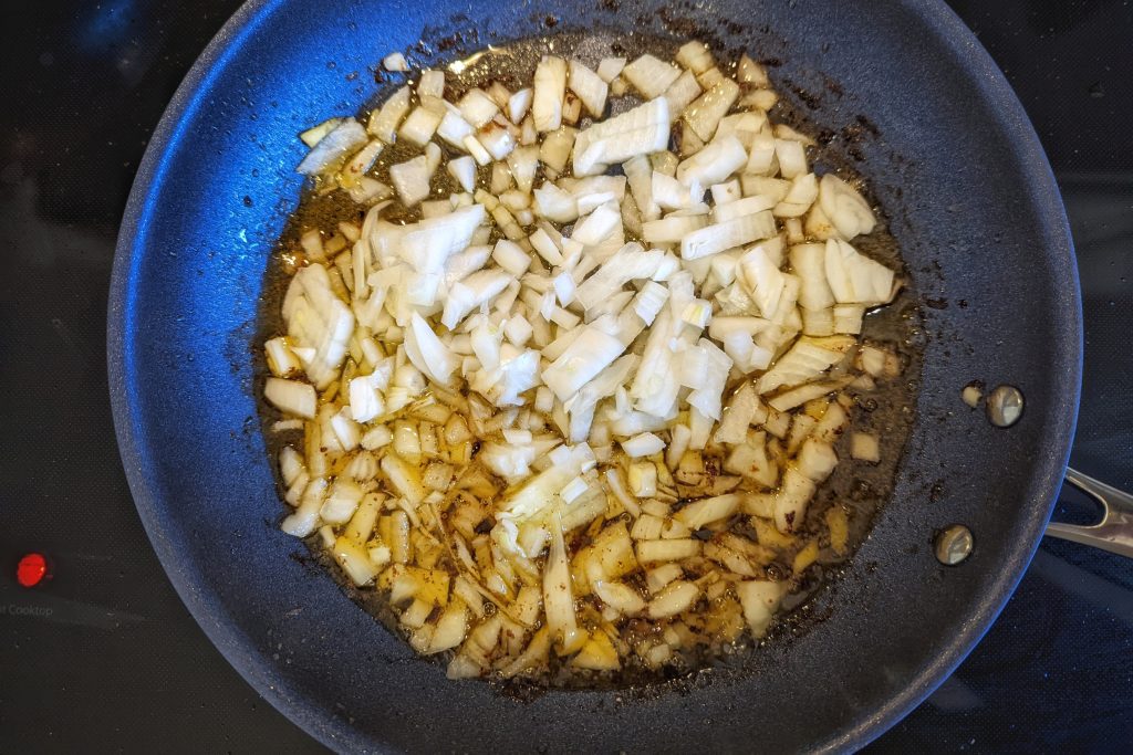 onions cooking in oil for the kefta tagine gravy