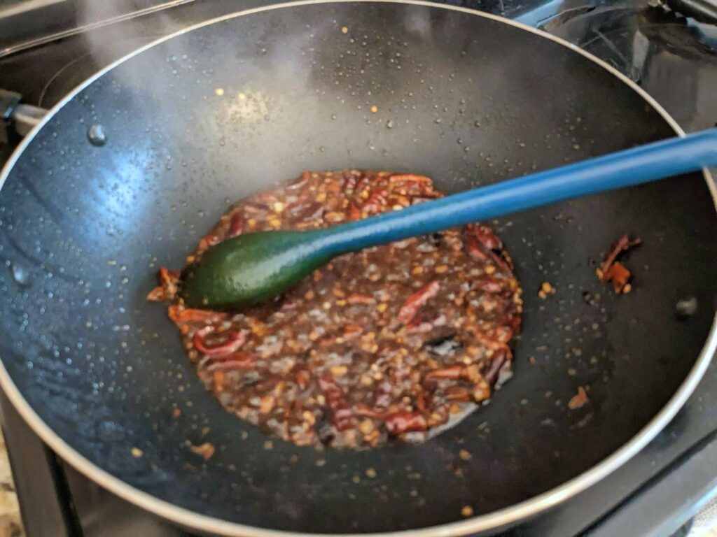 Sauce added to the aromatics in a wok.