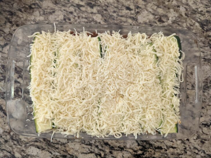 Finish the layers with zucchini strips and more mozzarella cheese.