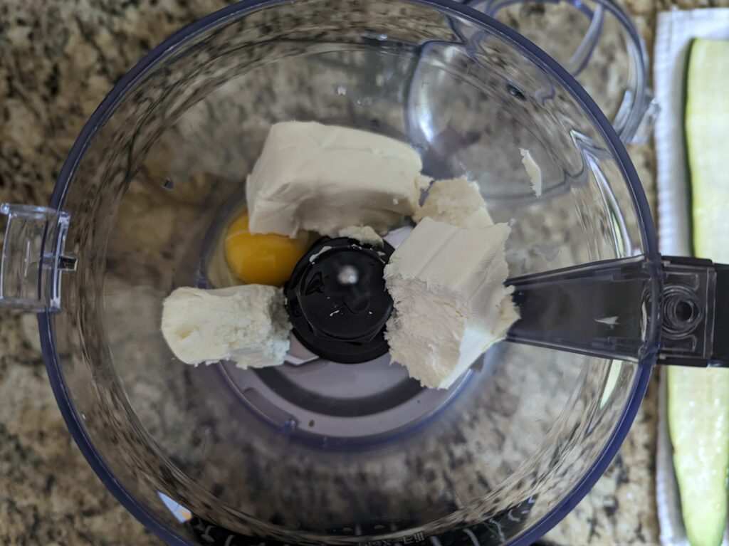 Mix the cream cheese and egg in a blender.