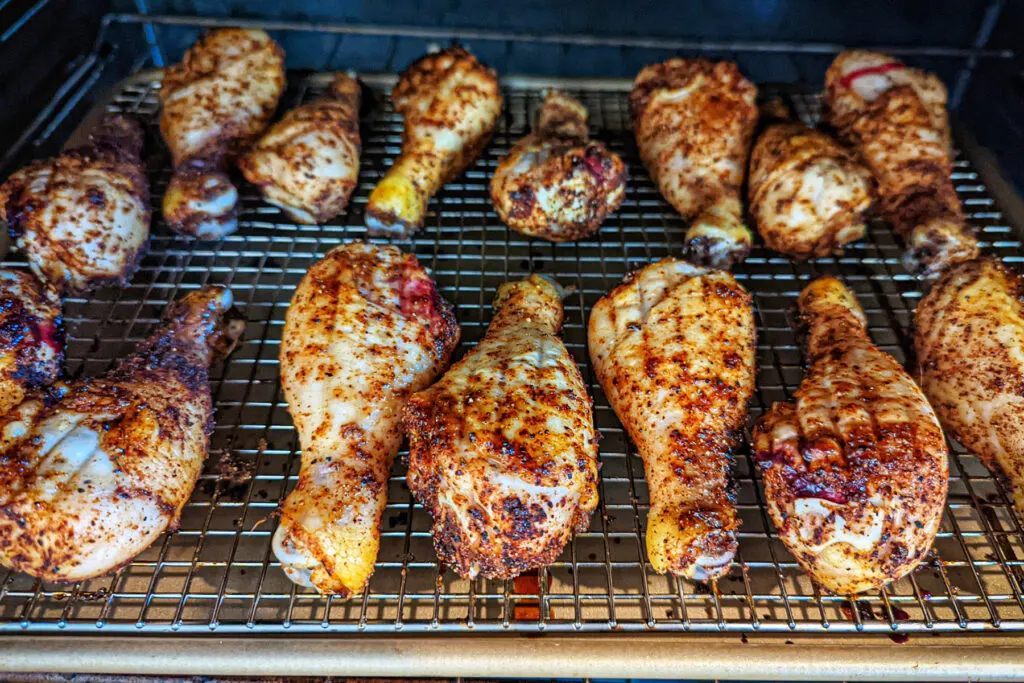 BBQ Baked Chicken Legs baking in the oven.