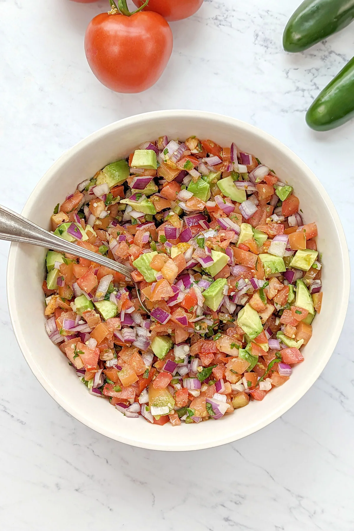 Chunky salsa in a serving dish.
