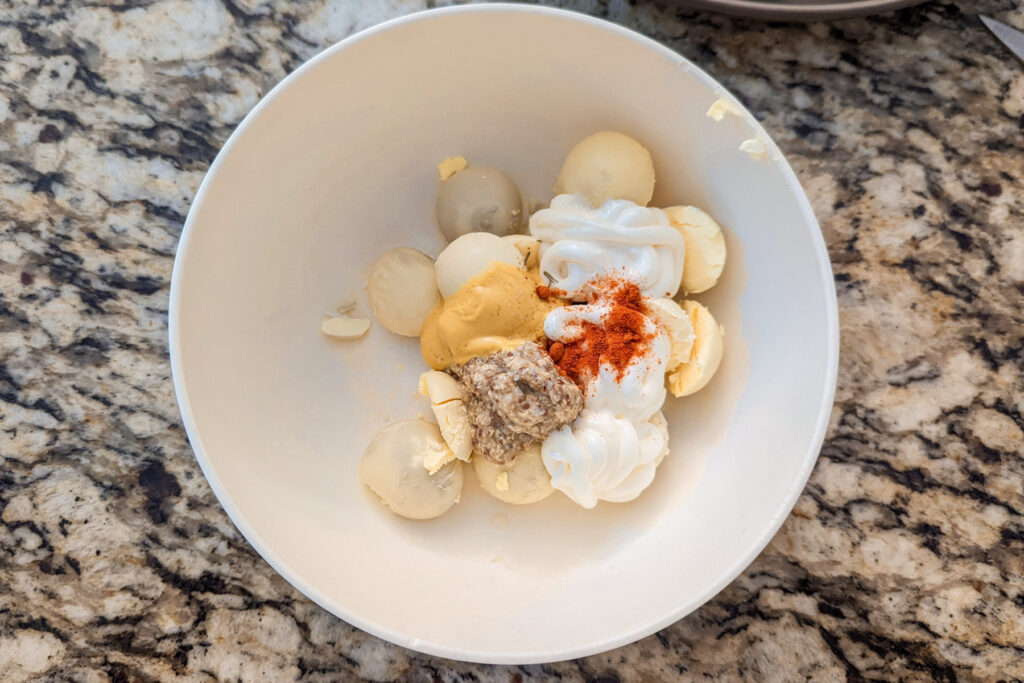 The deviled egg mixture in a small bowl. 