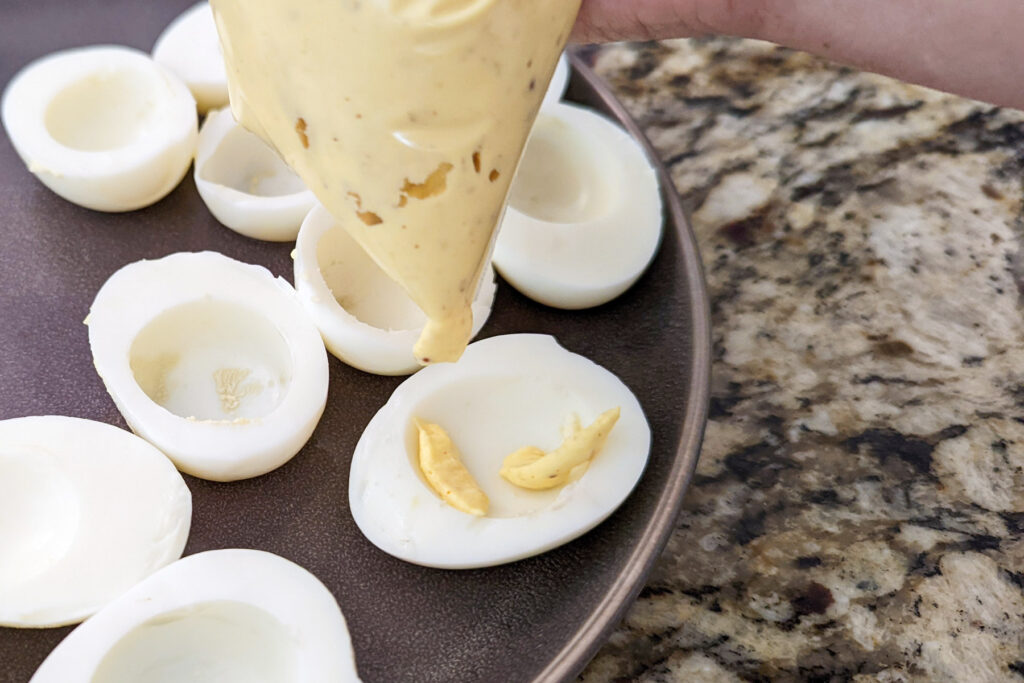Deviled egg filling in the egg whites. 