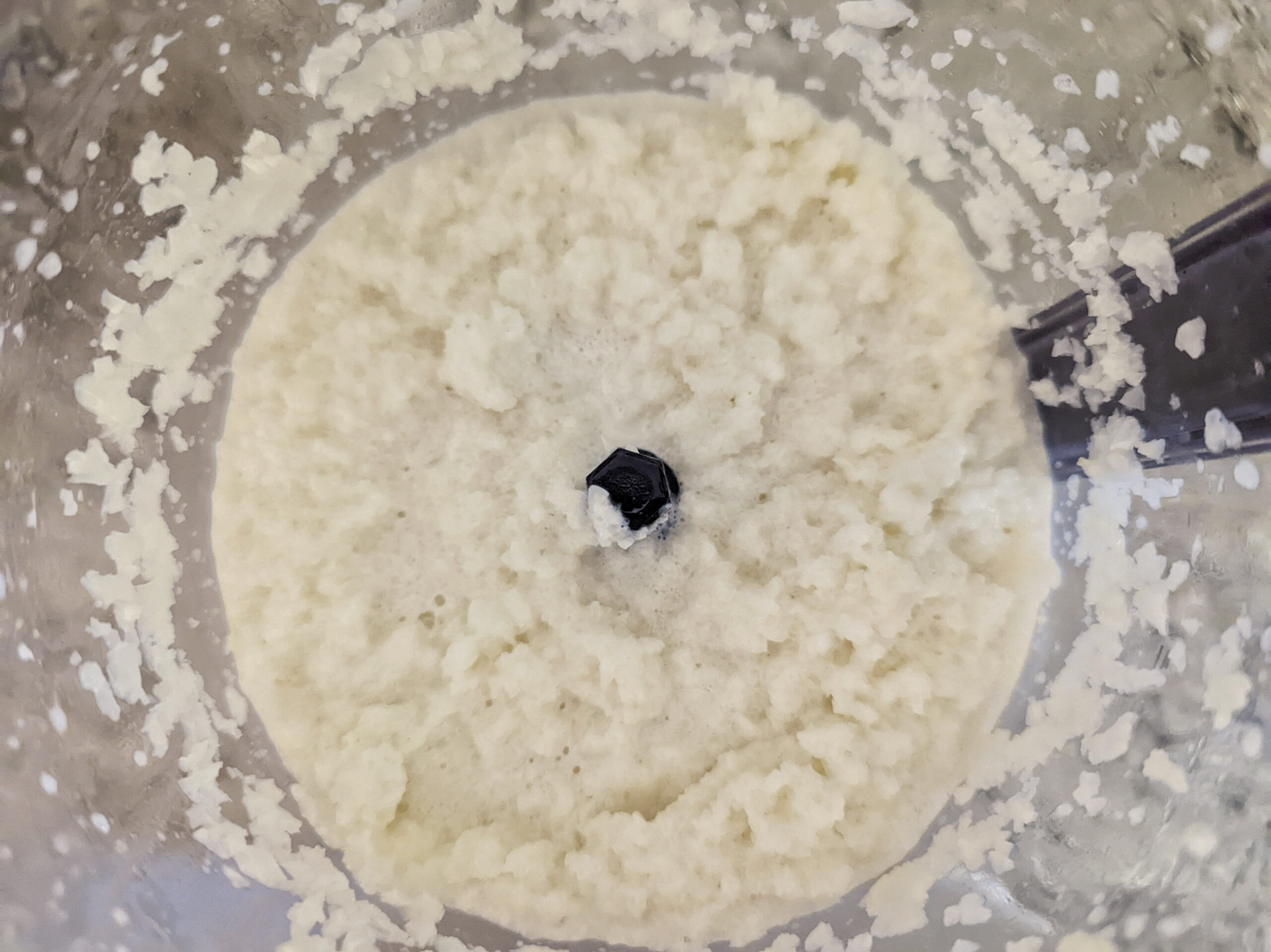 Place the tender cauliflower into the food processor to finish the mashed cauliflower recipe.