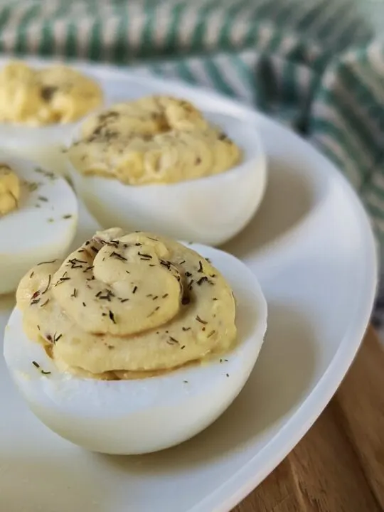 A close up plate of deviled eggs without vinegar.