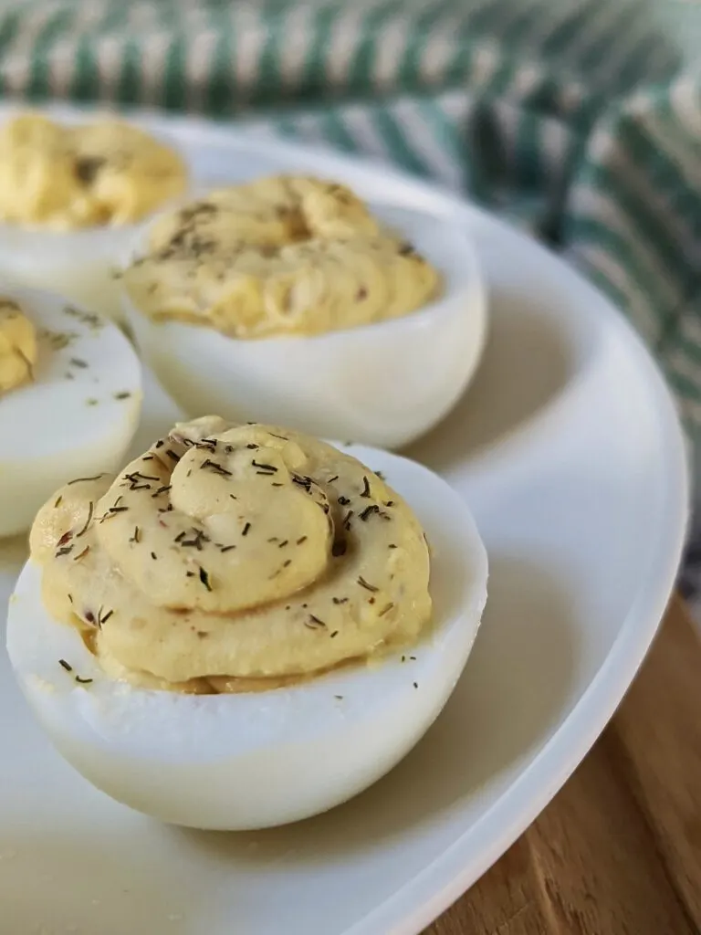 A close up plate of deviled eggs without vinegar.