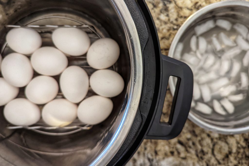 Fill an Instant Pot with one cup of water, add a trivet and add the hard boiled eggs to make perfect Instant Pot hard boiled eggs.