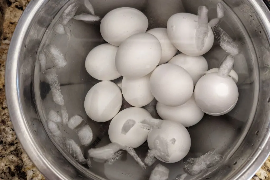 After cooking the Instant Pot hard boiled eggs, add them to a ice bath to halt the cooking.