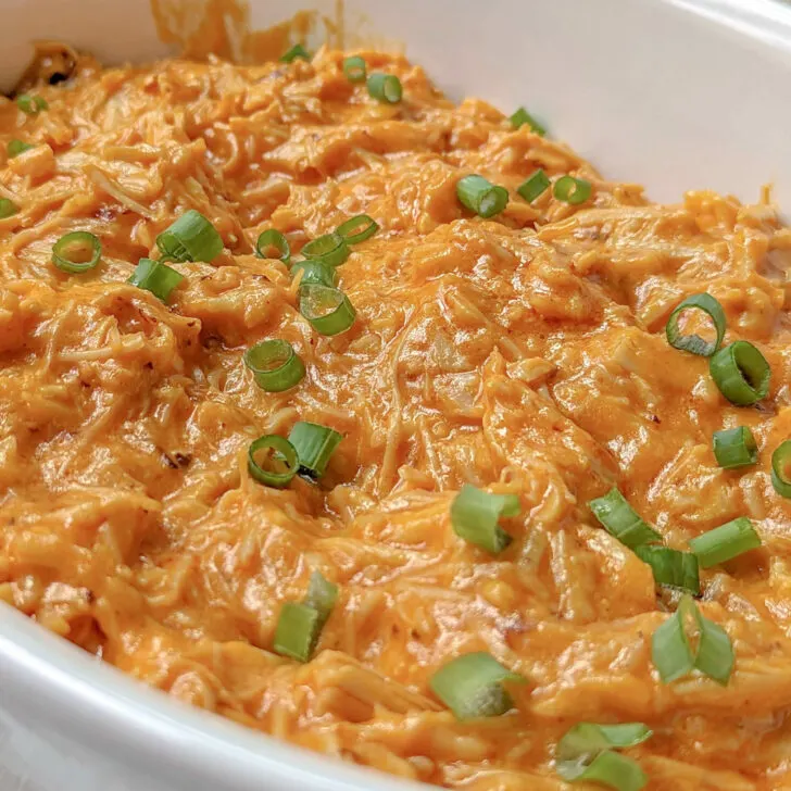 Instant Pot Buffalo Chicken Dip in a serving bowl with scallion topping.