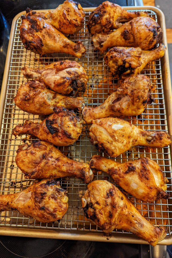 Line the drumsticks with Peruvian marinade on the wire rack to be roasted.