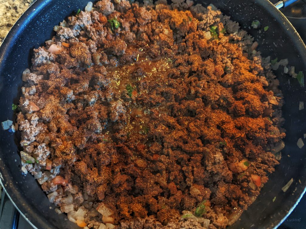 Our taco seasoning recipe sprinkled over ground beef for tacos..
