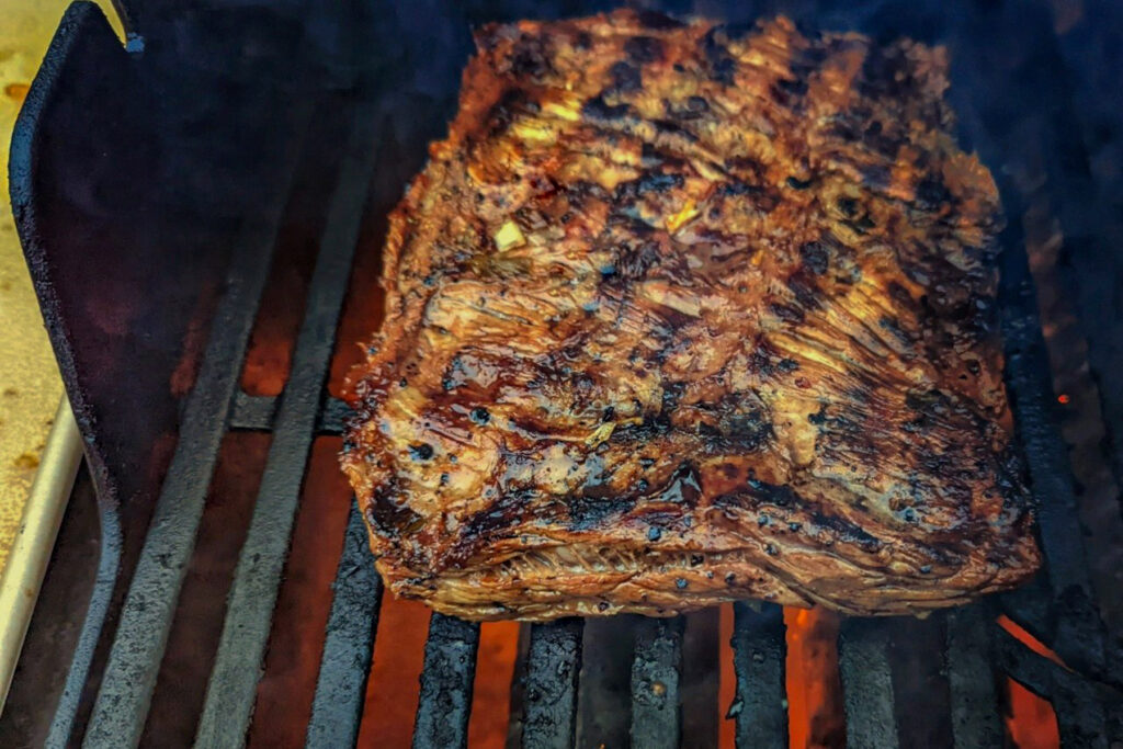 Carne asada searing on the grill.