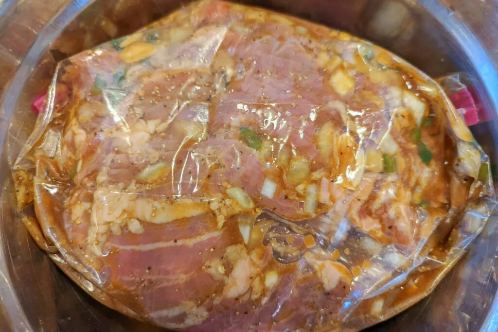 Marinated carne asada in a bag.